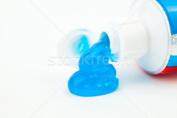 Close up of toothpaste outgoing of a toothpaste tube against white background Stock photo © wavebreak_media