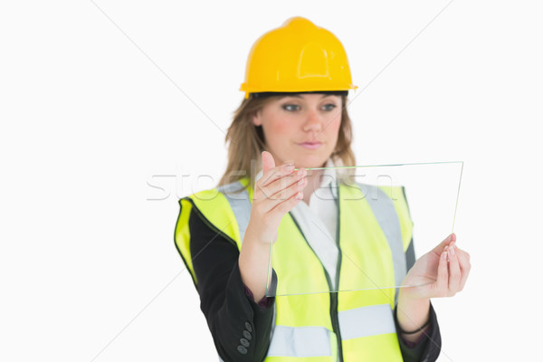 Female architect holding a pane while looking at it Stock photo © wavebreak_media
