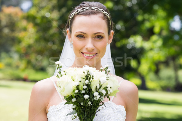 Bride with flower bouquet smiling in garden Stock photo © wavebreak_media