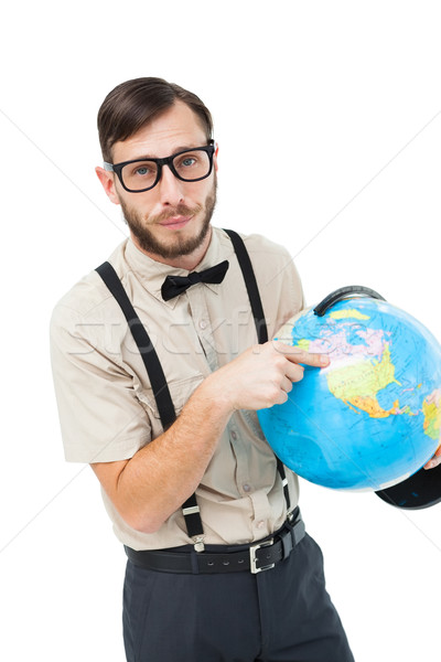 Stock photo: Geeky hipster pointing to globe