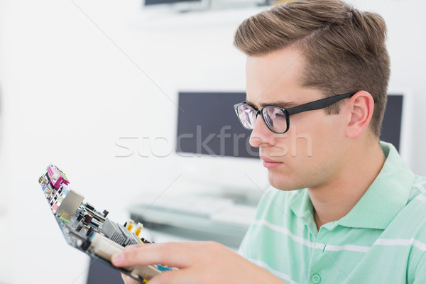 Stock photo: Technician working on broken cpu