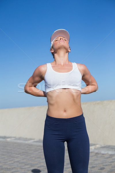 Fitt szőke nő megérint hát móló napos idő Stock fotó © wavebreak_media