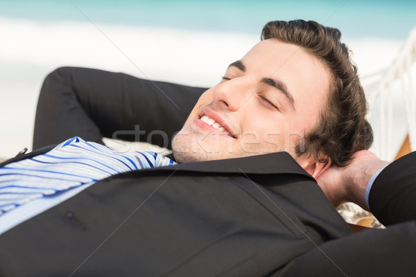 счастливым бизнесмен расслабляющая гамак пляж человека Сток-фото © wavebreak_media