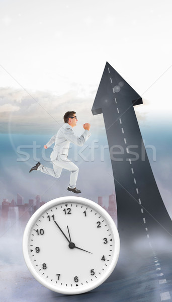 Composite image of geeky happy businessman running mid air Stock photo © wavebreak_media