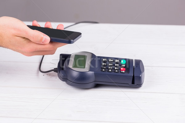 Man using smartphone to express pay  Stock photo © wavebreak_media