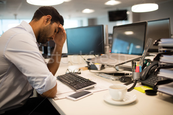 Restless businessman sitting in office Stock photo © wavebreak_media