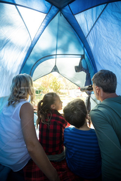 Rear view of family sitting in the tent Stock photo © wavebreak_media