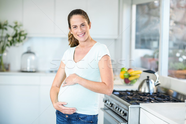 Portrait of happy woman in kitchen Stock photo © wavebreak_media