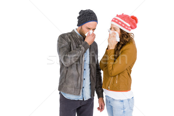 Stock photo: Sick young couple blowing nose