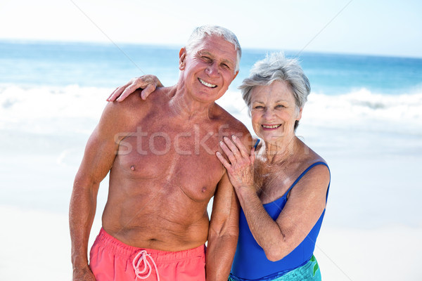 Cute mature couple embracing on the beach Stock photo © wavebreak_media