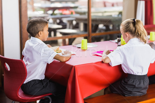 Garçon fille école déjeuner cafétéria [[stock_photo]] © wavebreak_media