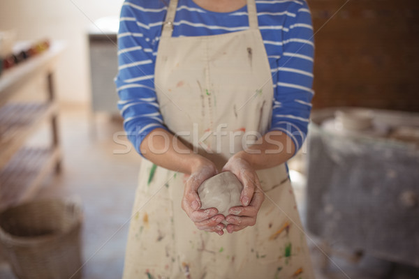 Mid section of female potter molding clay Stock photo © wavebreak_media