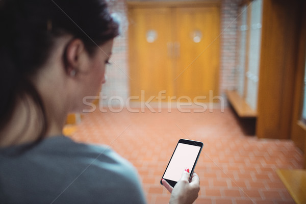 Mature student using mobile phone in the locker room Stock photo © wavebreak_media