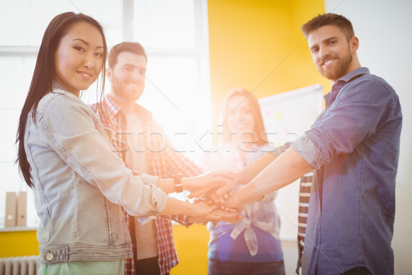 Portrait of smiling business people stacking hands Stock photo © wavebreak_media