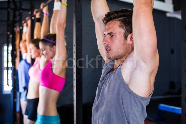 Man doing chin-ups in gym Stock photo © wavebreak_media