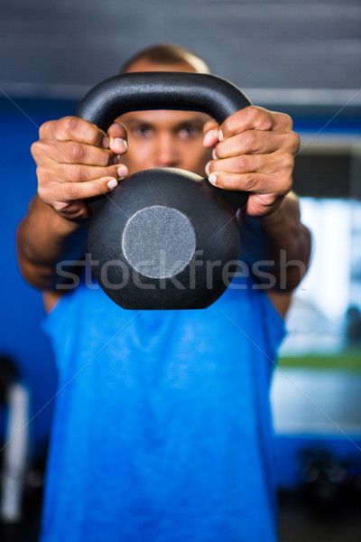 Man covering face with kettlebell Stock photo © wavebreak_media