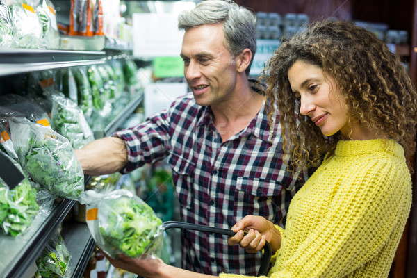 Happy couple selecting vegetables in organic section Stock photo © wavebreak_media