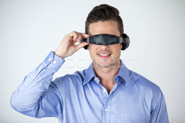 Man using virtual video glasses Stock photo © wavebreak_media