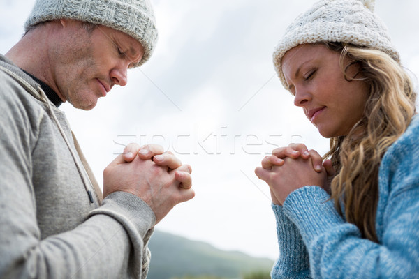 Couple praying with hands clasped Stock photo © wavebreak_media