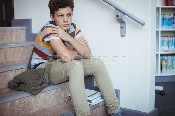 Szomorú iskolás fiú ül egyedül lépcsőház iskola Stock fotó © wavebreak_media