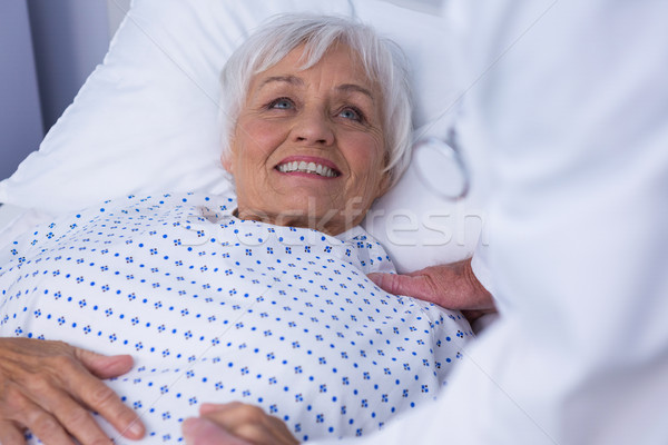 Mid-section of doctor consoling senior patient  Stock photo © wavebreak_media