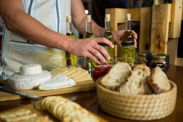 Olive oil, jam, pickle placed together on table Stock photo © wavebreak_media