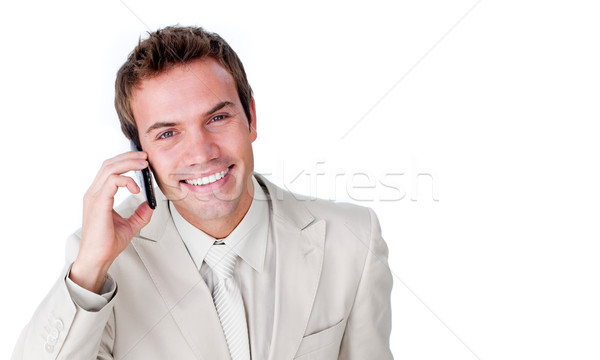 Stock photo: Close-up of a charming businessman using a mobile phone