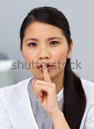 Ethnic businesswoman asking for silence  Stock photo © wavebreak_media