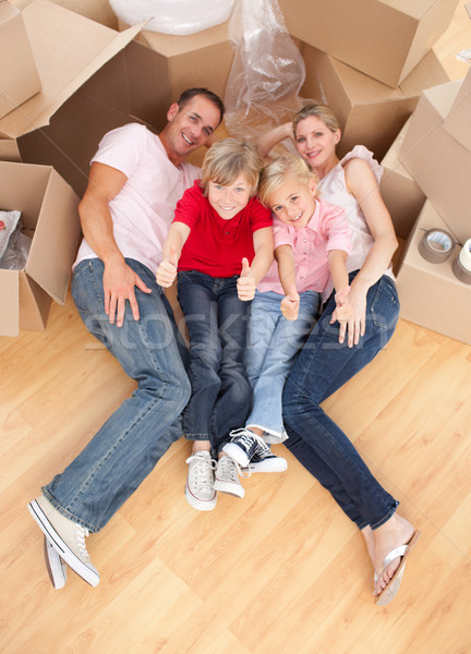 Cheerful family lying on the floor Stock photo © wavebreak_media