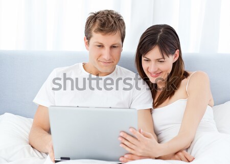 Romantic couple reading a newspaper and drinking coffee  Stock photo © wavebreak_media