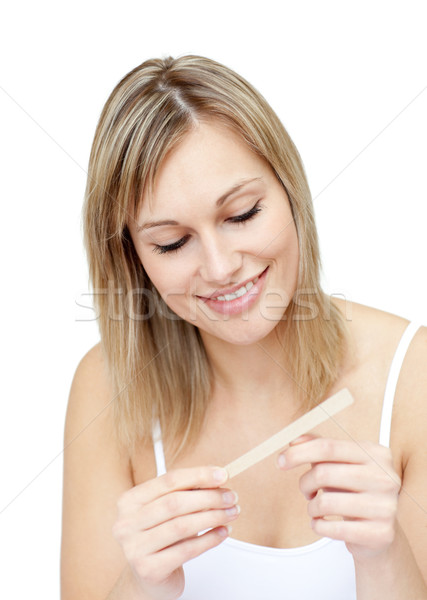 Portrait of an attractive  woman filing her nails Stock photo © wavebreak_media