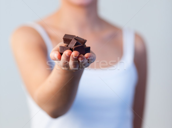 Close-up of woman holding chocolate focus on chocolate  Stock photo © wavebreak_media