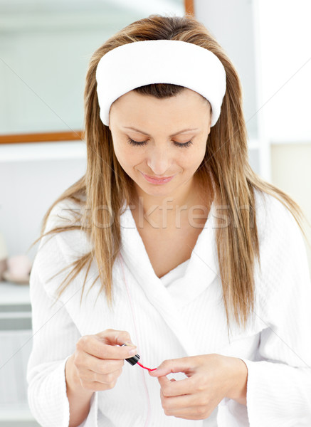 Sophisticated caucasian woman varnishing her fingernails in the bathroom at home Stock photo © wavebreak_media