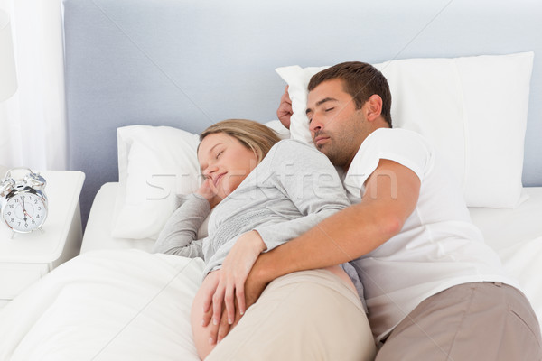 Cute Couple Of Future Parents Doing A Nap In The Bedroom