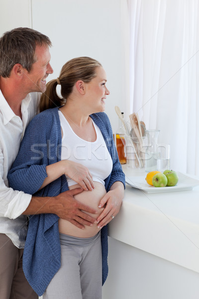 Couple hugging in the kitchen at home Stock photo © wavebreak_media