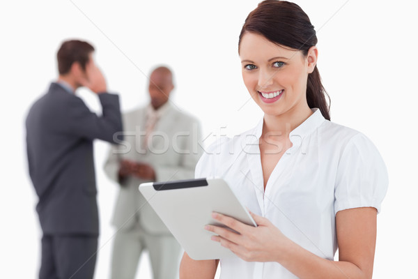 Tradeswoman with tablet and associates behind her against a white background Stock photo © wavebreak_media