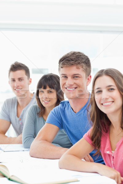 A group of brightly smiling people looking into the camera  Stock photo © wavebreak_media