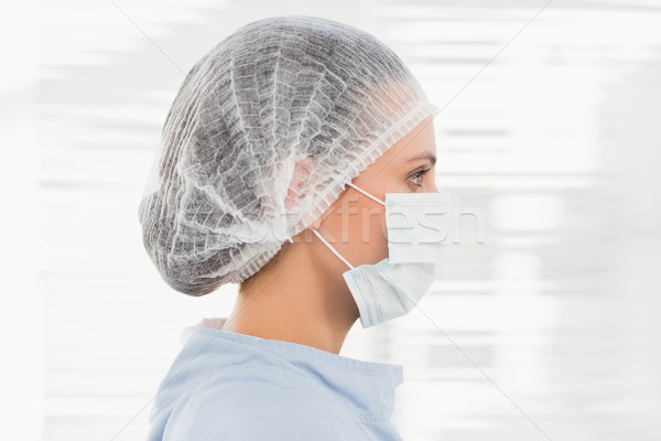 Female surgeon wearing surgical cap and mask Stock photo © wavebreak_media