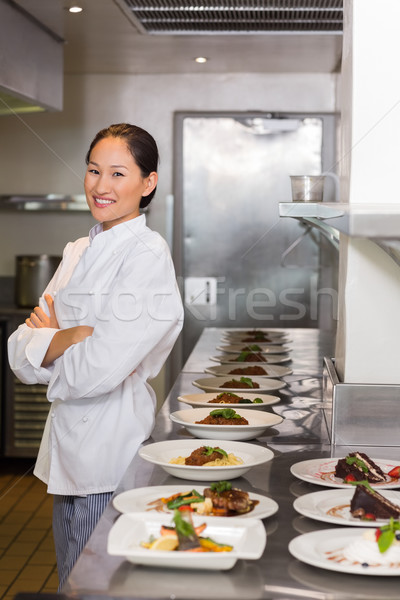 Feminino chef cozinhado comida cozinha Foto stock © wavebreak_media