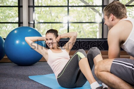 Couple doing sit ups on exercise balls Stock photo © wavebreak_media