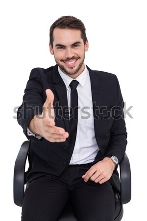 Smiling businessman on an chair office offering handshake Stock photo © wavebreak_media