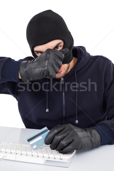 Hacker removing his balaclava to show his face Stock photo © wavebreak_media