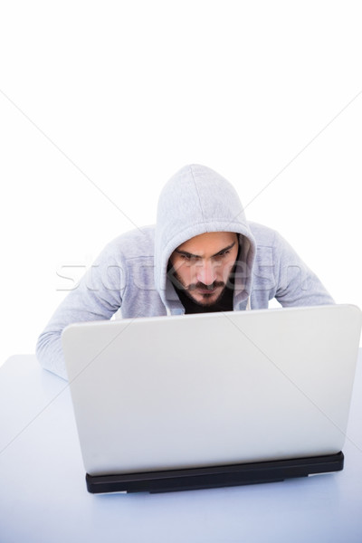 Serious burglar hacking into laptop Stock photo © wavebreak_media