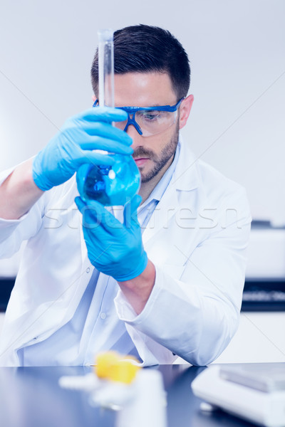 Science student looking at beaker Stock photo © wavebreak_media