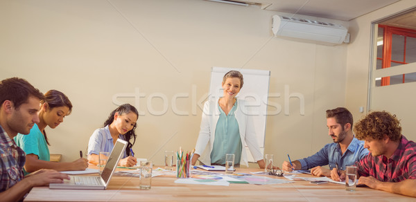 Femme d'affaires présentation collègues jeunes portable [[stock_photo]] © wavebreak_media