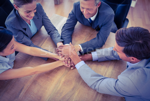 Business people joining hands in a circle Stock photo © wavebreak_media