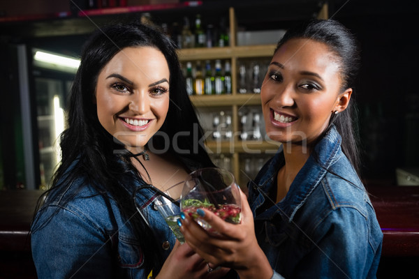 Portrait of happy friends having cocktail Stock photo © wavebreak_media