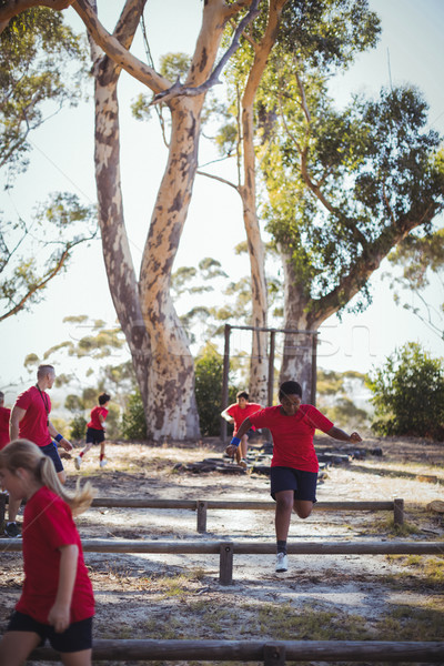 Trainer instructing kids during obstacle course training Stock photo © wavebreak_media