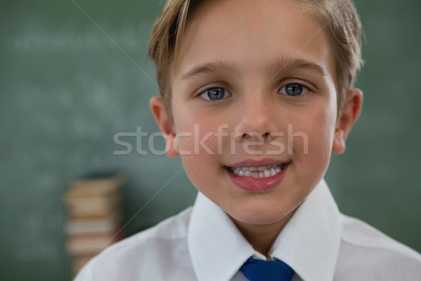 Glimlachend schooljongen schoolbord portret man kind Stockfoto © wavebreak_media