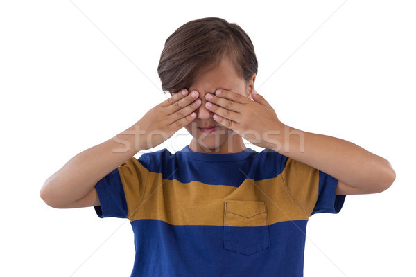 Cute boy covering his eyes Stock photo © wavebreak_media